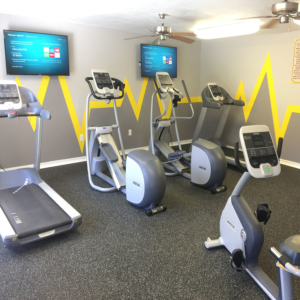 Fitness center with treadmills, elipticals, bike and flat screen tv's
