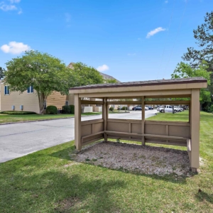 School Bus stop right at the entrance of Cypress Lake with kid-friendly patio cover