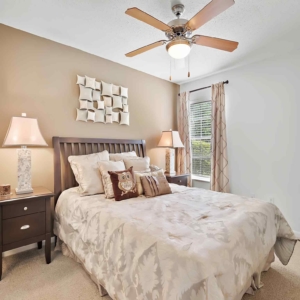 Alternate view, Master bedroom of the model home at Cypress Lake, lots of natural light and a ceiling fan